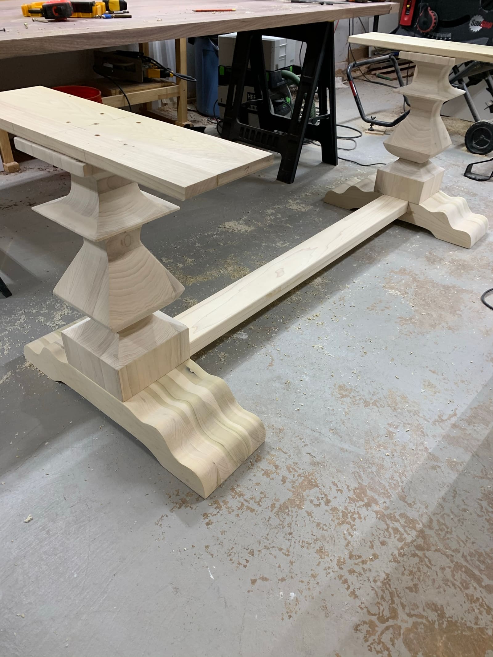 The custom pedestal base for the walnut table, milled in the shop