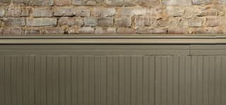 Board and batten wainscoting in warm gray